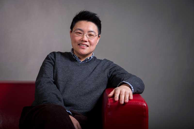 Image of Sun Kang on the MU red chair. 